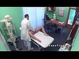 Doctor between legs of sexy blonde patient